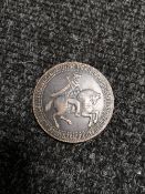 A commemorative copper medallion