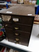 A mid century metal five drawer desk chest