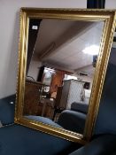 A gilt framed mirror