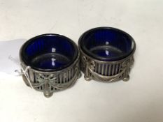A pair of Neo-Classical silver salts with blue glass liners.