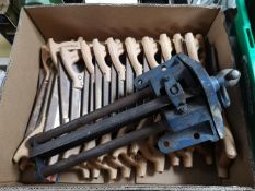 A box of wood working saws and vice