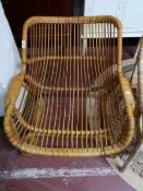 A mid century wicker armchair.