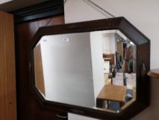 An Edwardian oak bevelled mirror