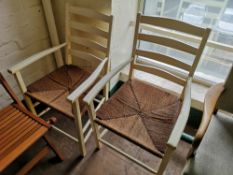 Two ladder back painted sea grass armchairs.