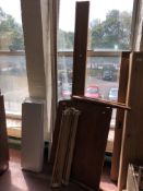 A mid century teak tiled bed frame and a wooden bookshelf