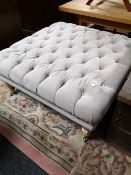 A contemporary studded upholstered oversized footstool CONDITION REPORT: 87cm by