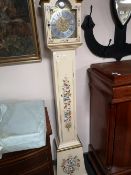 A decorative painted grandmother clock