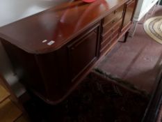 A mid 20th century mahogany sideboard fitted with five drawers.