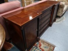 A reproduction mahogany inverted breakfronted sideboard