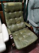 A green studded leather adjustable relaxer chair.