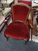 A reproduction armchair in red dralon