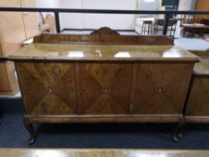 A mid century triple door sideboard