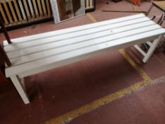 A painted pine wooden slatted bench.