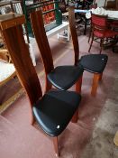 A contemporary extending dining room table and six chairs.