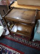 An oak two tier trolley with lift out tray