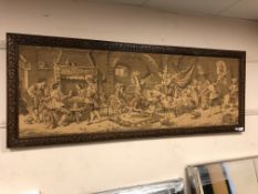 A carved oak framed tapestry depicting a tavern