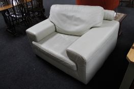 A contemporary white leather armchair