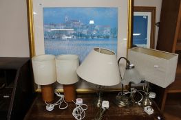 Two gilt framed colour prints together with a collection of table lamps