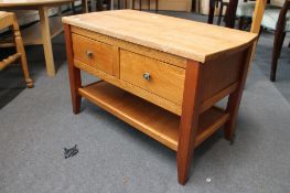 A light oak two drawer low table CONDITION REPORT: 78cm wide by 42cm deep by 50cm