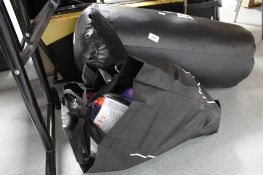 A punch bag and bag of fitness items