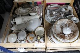Two crates of china plates, cutlery, gilded tea china,