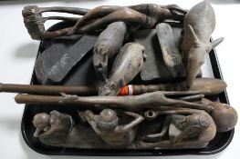 A tray of African carvings, eastern figures,