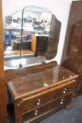 An early twentieth century figured walnut wardrobe and dressing table