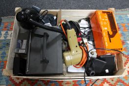 A box of Black & Decker tool, portable radio, table lamp,