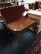 A Victorian inlaid mahogany tea table