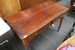 A Victorian mahogany two drawer side table