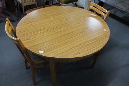 A formica topped kitchen table and two chairs