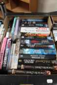 A box of paperback books