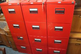 Three red metal four drawer filing chests