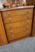 An early twentieth century oak five drawer chest