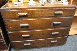 An early twentieth century oak four drawer chest