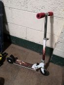 A child's scooter and a quantity of bike helmets etc