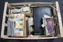A crate of stamp albums,