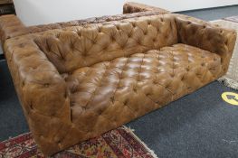 A brown studded leather Chesterfield style settee CONDITION REPORT: This is a pair