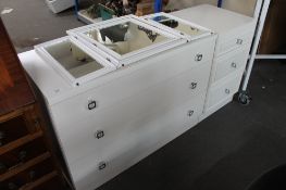 A contemporary three drawer chest with matching white three drawer chest and mirror