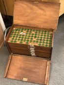 An antique mahogany coins collector's cabinet,