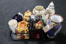 A tray of cottage tea pots, coronation beaker,