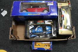 A box of die cast vehicles,