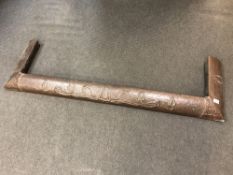 An Art Nouveau hammered copper fire curb