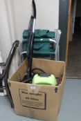 Two folding patio chairs together with a boxed Polti steam cleaner and vac