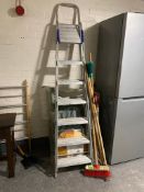 A folding plastic garden lounger together with a bundle of garden tools and large set of folding