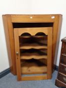 A nineteenth century pine corner cabinet