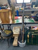 A collection of assorted fishing rods, landing net,