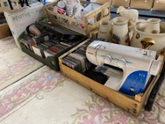 Two crates of Toshiba blu-ray player, Necchi sewing machine (a/f), digital cameras,