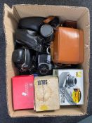 A box of a quantity of assorted cameras