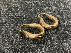 A pair of 9ct gold earrings